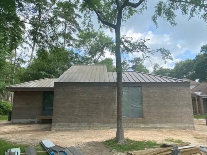 Brick home with a new metal roof
