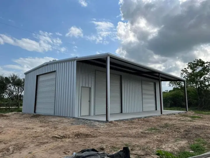 Gray shop with a side lean-to