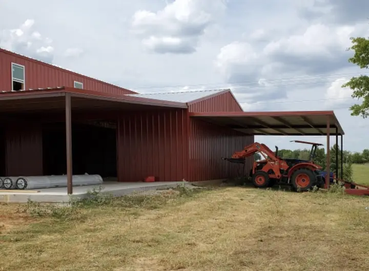 Red barn with a lean-to