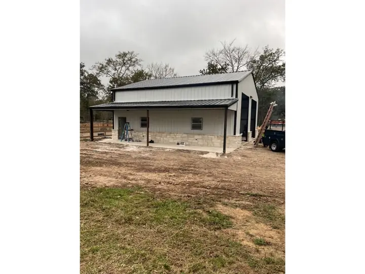 Small metal home with a front porch