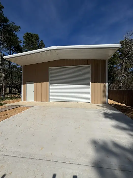 Tan building with a white overhang