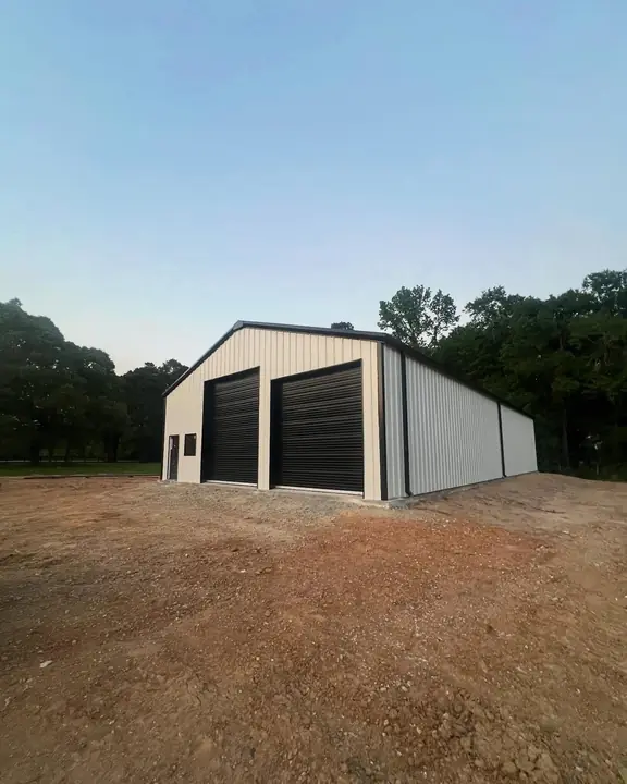 Tan shop with black roll-up doors