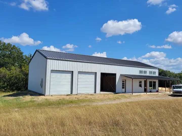 White shop with living quarters and porch